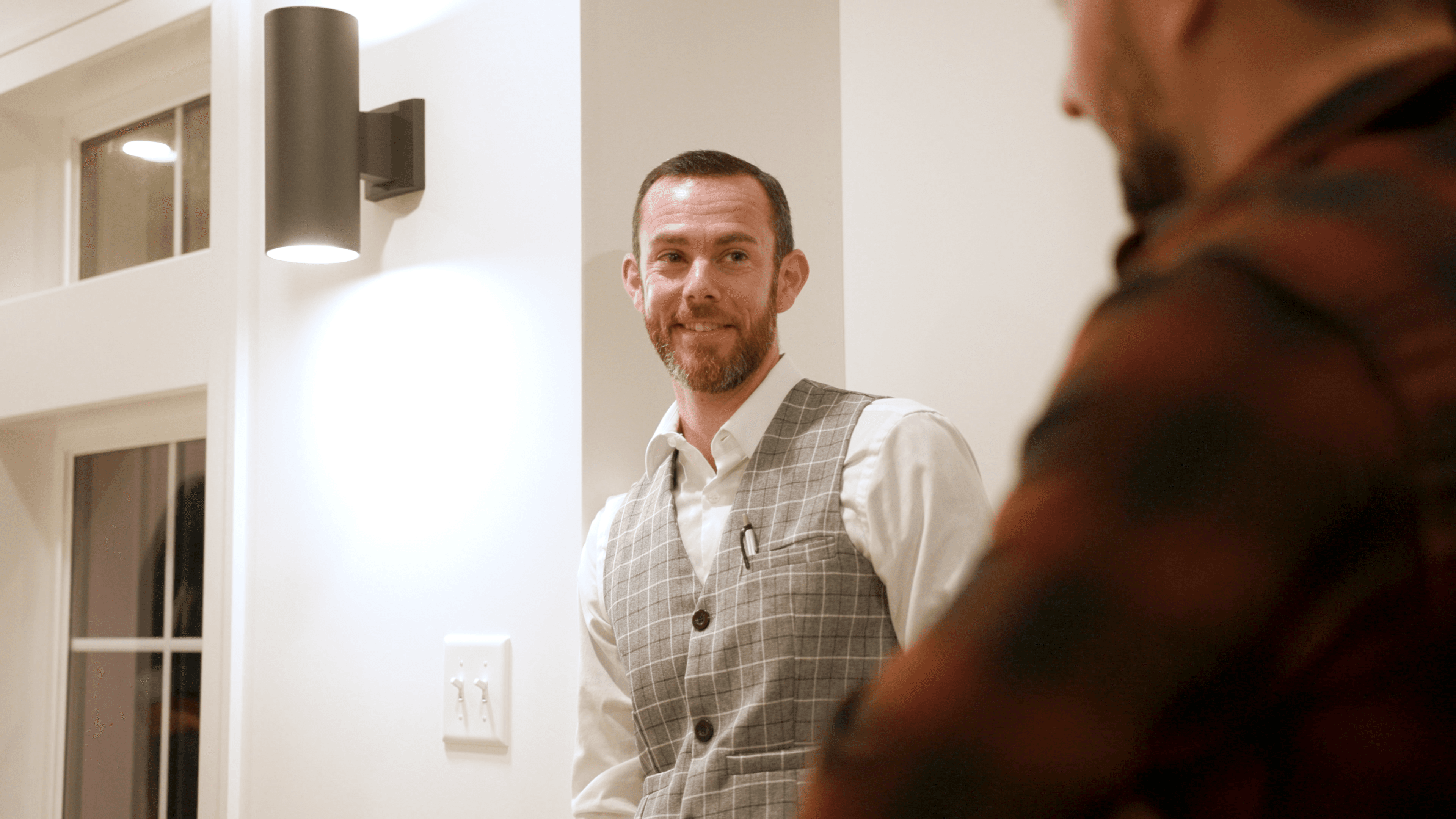 David Forster, Brain Performance Coach, smiling in a vest at home